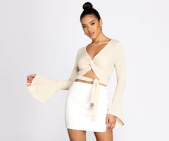 Top de belleza con cinturón y campana