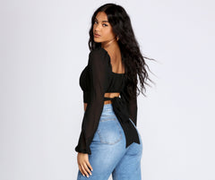 Bonita blusa plisada con lazo en la cintura