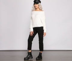 Suéter acogedor de punto con pestañas y hombros descubiertos