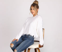 Suéter corto de manga larga de punto destrozado