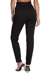 Pantalones clásicos con cintura anudada y bolsa de papel