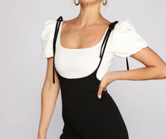 Freche Hose mit weitem Bein und Hosenträgern