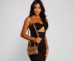 Mini bolso bandolera con asa superior de cocodrilo