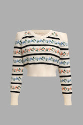 Suéter floral con hombros acolchados