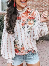 Blusas con cuello alto y mangas abullonadas estampadas