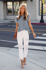 Blusa vaquera sin mangas con botones que llama la atención sin esfuerzo