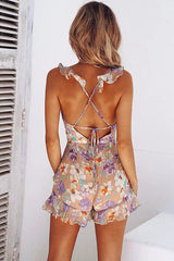 Mono con espalda descubierta y volantes con estampado de loto