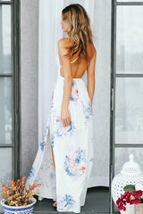 Vestido largo con abertura alta y flor de jazmín