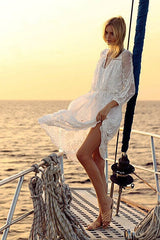 Vestido midi con cintura anudada y bordado de encaje