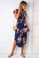 Vestido midi con estampado floral y cuello abierto