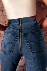 Vaqueros ajustados con cremallera en la espalda