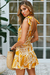 Vestido entallado con lazo y estampado de hojas