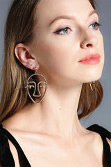 Pendientes de cara metálica