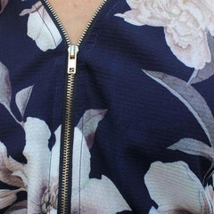 Blusas sexis de manga larga con cuello en V y cremallera estampada