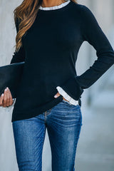 Suéter de punto negro con dobladillo blanco de As It Happens