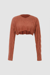 Suéter corto de punto trenzado con dobladillo curvo