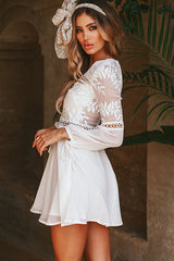 Minivestido acampanado con bordado floral de encaje