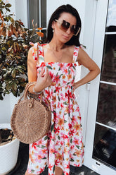 Date un capricho con este minivestido con lazo y estampado floral