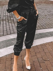 Pantalones de PU con bolsillos y cordón