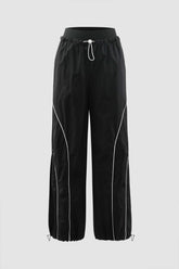 Pantalones cargo con cordón y costuras en contraste