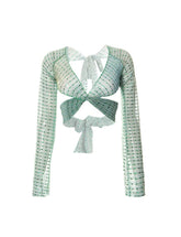 Top corto de manga larga con nudo en la espalda y lentejuelas cruzadas