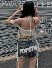 Top corto de tirantes con volantes y serpentinas para salir en verano