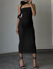 Vestido elegante de fiesta con top de tubo y cinta de rosa de los vientos retro