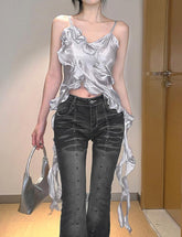 Camisola corta irregular con flecos y volantes en la espalda