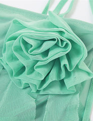 Vestido mini de tirantes con volantes, borlas y decoración floral