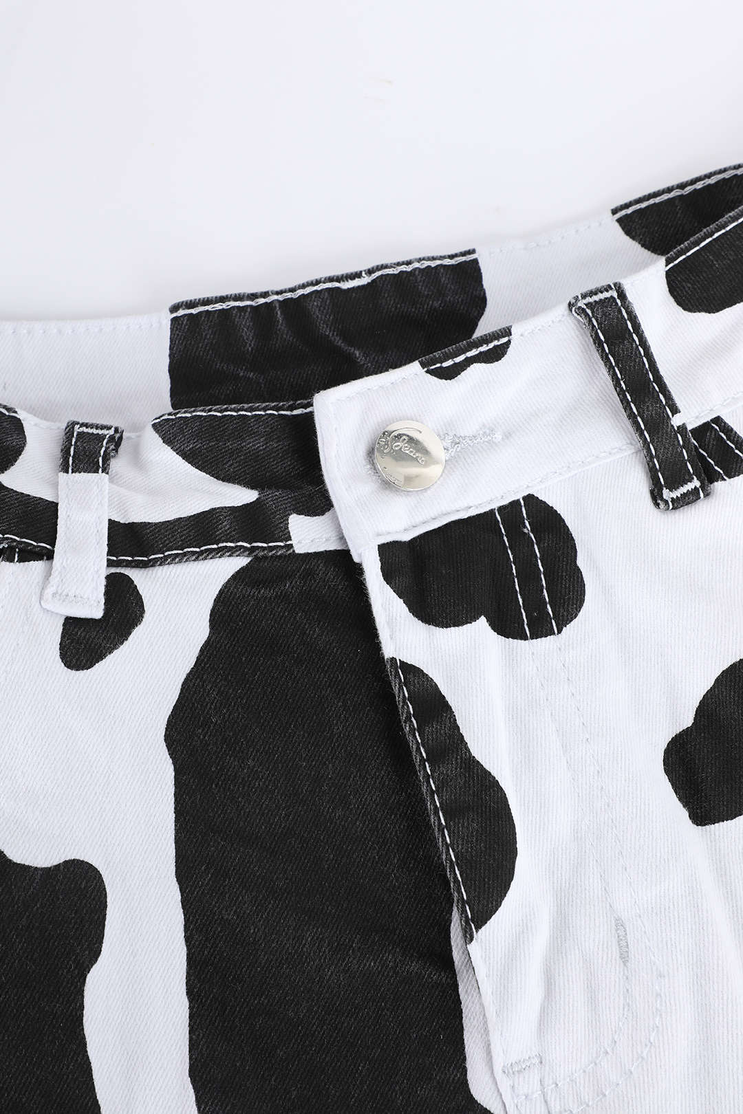 Cow Print Flared Leg Jeans